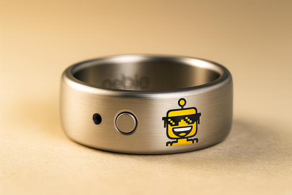 Close-up of a Pebble Index 01 smart ring with a tiny engraved SiliconSnark robot on its outer band.